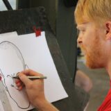 man drawing caricature
