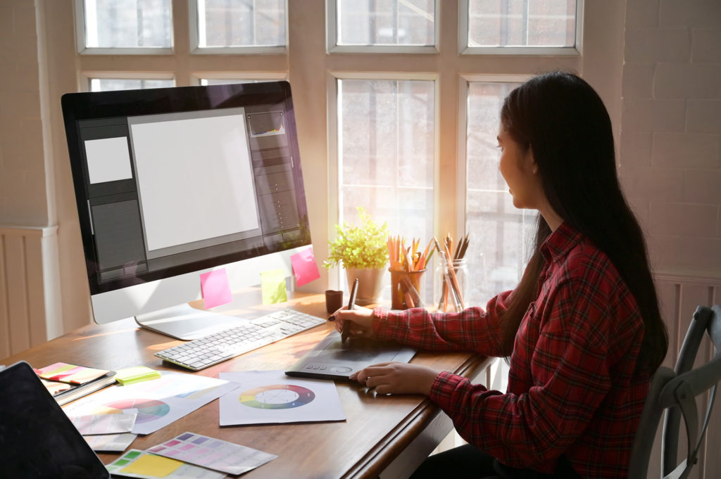 Graphic designer woman working on creative office with create graphic on computer.